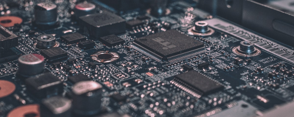 Technician cleaning inside a computer